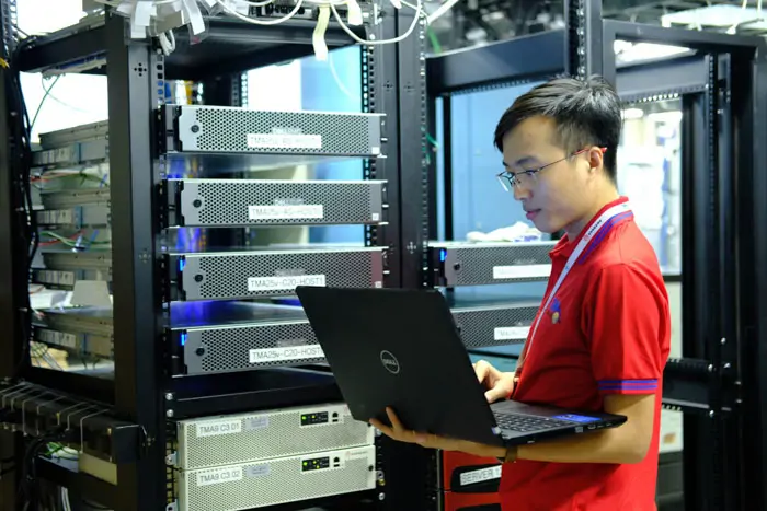 TMA Solutions conducts thorough planning and analysis to ensure successful software development Automotive embedded software development team discussing testing strategies